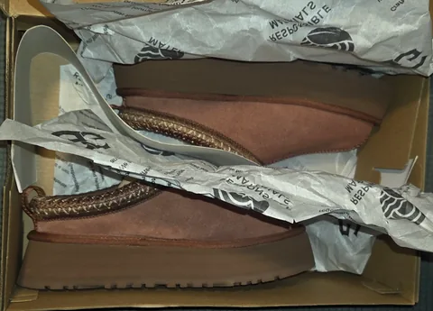 The pair in the original UGG box with branded tissue