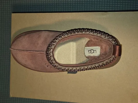 Top view of the UGG Tazz showing the faux-fur lining and UGG insole label